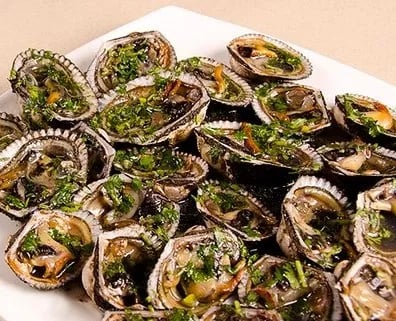 Conchas asadas: un deleite de los manglares